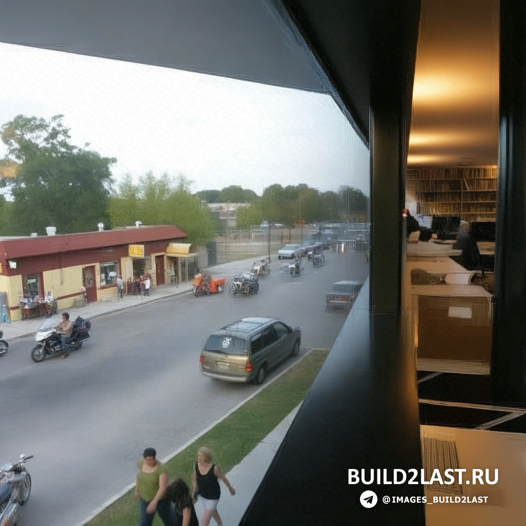 Необычный музей с криволинейными формами и стеклянными стенами, отражающими окрестности